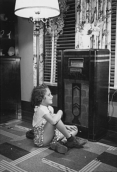 Girl listening to old fashioned radio